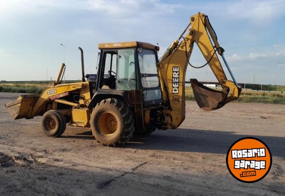 Camiones y Grúas - Pala retro John Deere 310e modelo 2002 - En Venta