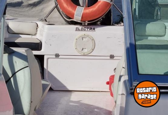 Embarcaciones - Trucker Electra 560 con motor Mercury 115HP Optimax (año 2013) - En Venta