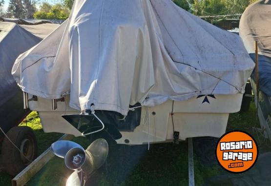 Embarcaciones - Trucker Electra 560 con motor Mercury 115HP Optimax (año 2013) - En Venta