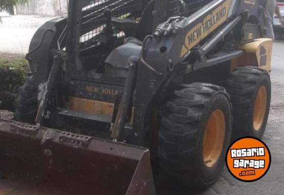 Camiones y Grúas - Minicargadora NH218 con accesorios - En Venta