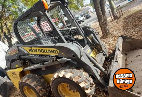 Camiones y Grúas - Minicargadora NH218 con accesorios - En Venta