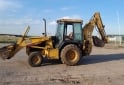 Camiones y Grúas - Pala retro John Deere 310e modelo 2002 - En Venta