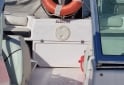 Embarcaciones - Trucker Electra 560 con motor Mercury 115HP Optimax (año 2013) - En Venta