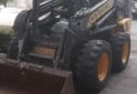 Camiones y Grúas - Minicargadora NH218 con accesorios - En Venta